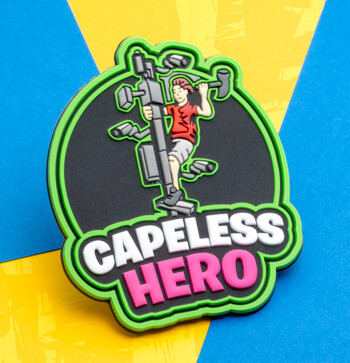 Custom PVC lapel pin featuring the text Capeless Hero and a character climbing a pole with security cameras.