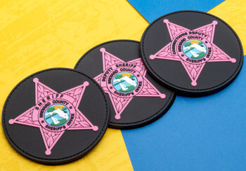 Circular PVC patch for the Brevard County Sheriff's Office featuring a pink five-point star and deputy corrections text.