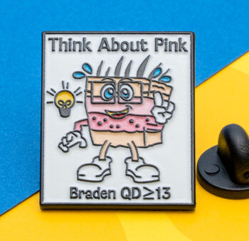 Rectangular lapel pin with a cartoon character, a lightbulb icon, and the text Think About Pink Braden QD≥13.