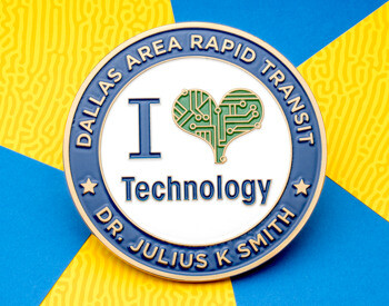 Dallas Area Rapid Transit challenge coin featuring 'I Love Technology' text with a circuit board heart on a white background and blue outer ring.
