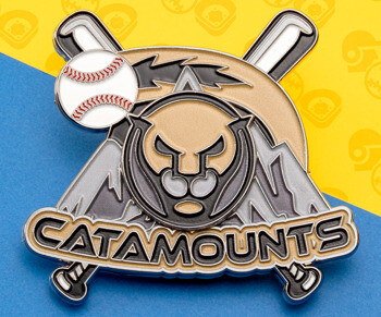 Catamounts baseball lapel pin featuring a cougar face, crossed bats, a baseball, and mountains in black, gold, and silver.