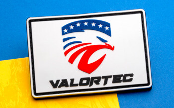 Rectangular PVC patch featuring the Valortec brand name and a stylized eagle logo in red, white, and blue against a white background.